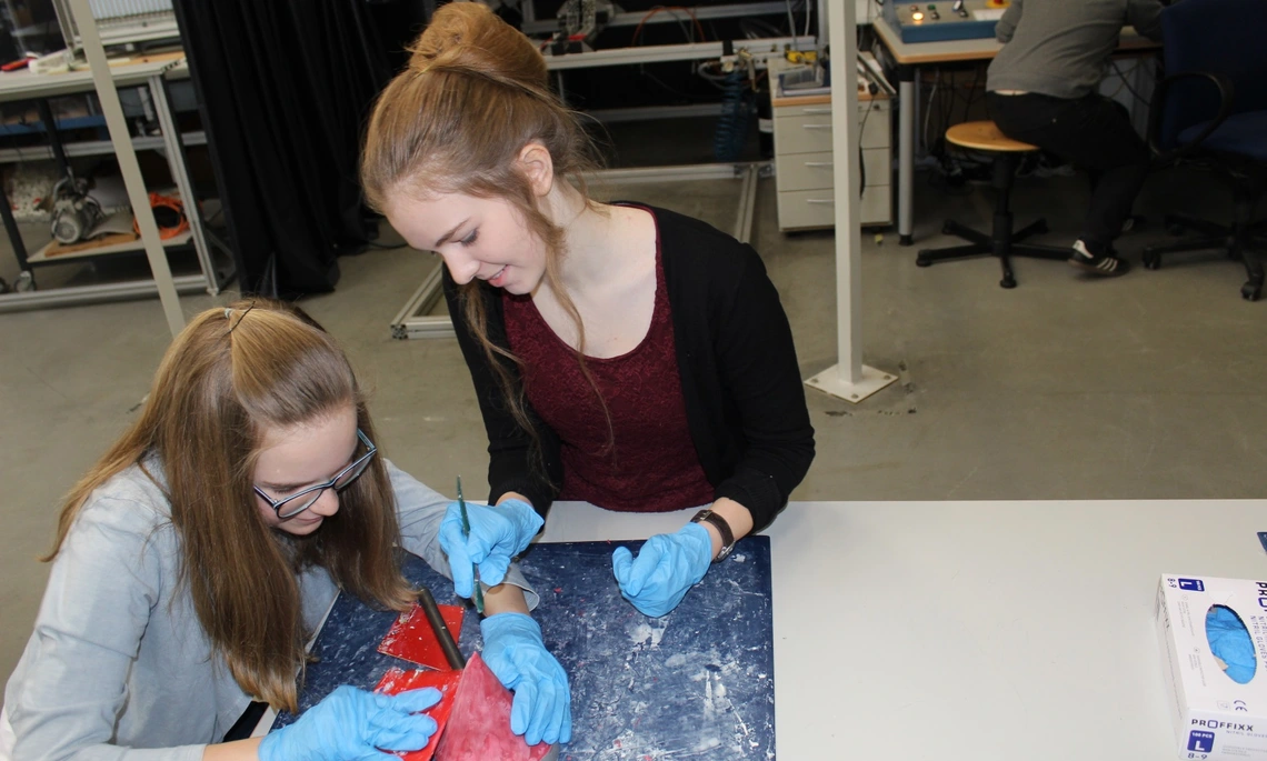 Two girls work in the research lab