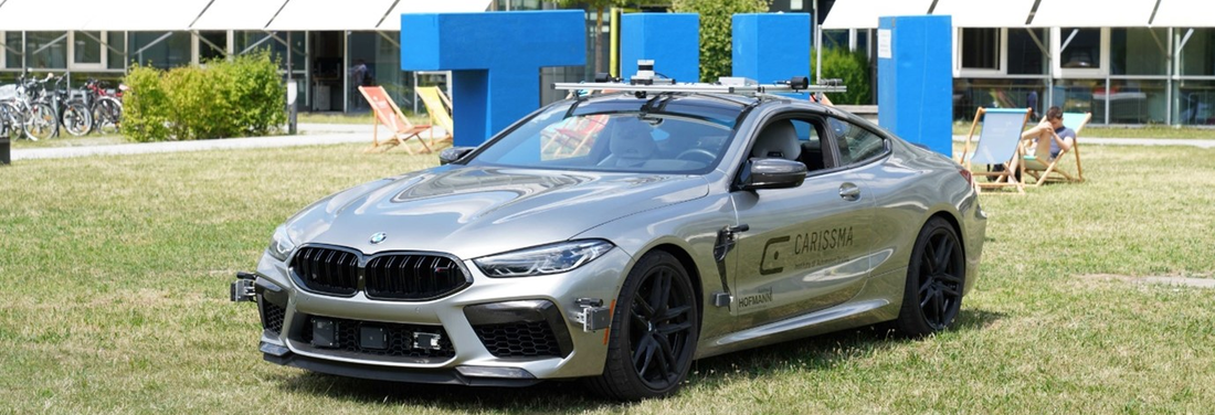 Picture of a CARISSMA test vehicle on the campus lawn